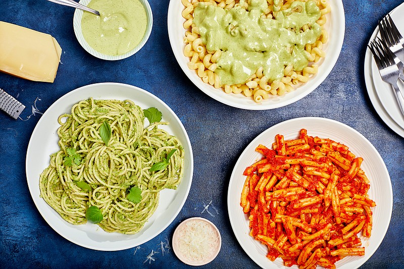 Try one of Sabrina Ghayour's quick, no-cook pasta sauces, from left, Walnut, Spinach and Herb With Zucchini; Yogurt, Tarragon and Pistachio; and Pepper, Harissa and Tomato. (For The Washington Post/Justin Tsucalas)