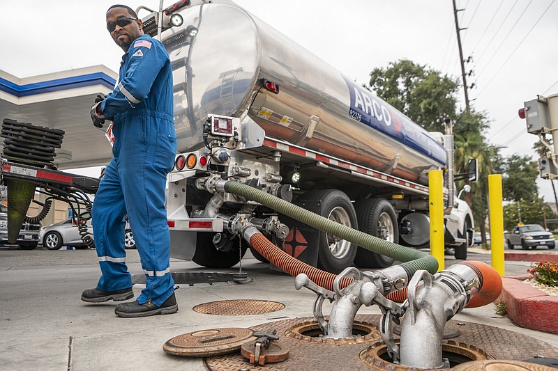 A driver delivers 8,500 gallons of gasoline at an ARCO gas station in Riverside, Calif., Saturday, May 28, 2022. (AP Photo/Damian Dovarganes, File)