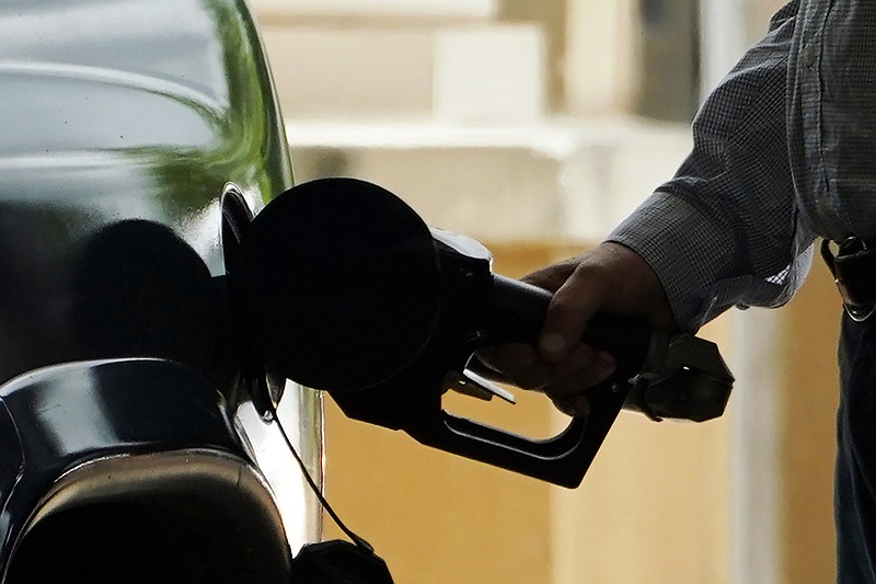 FILE- A customer pumps gas into his vehicle at this Madison, Miss., Sam's Club, on May 24, 2022. (AP Photo/Rogelio V. Solis, File)