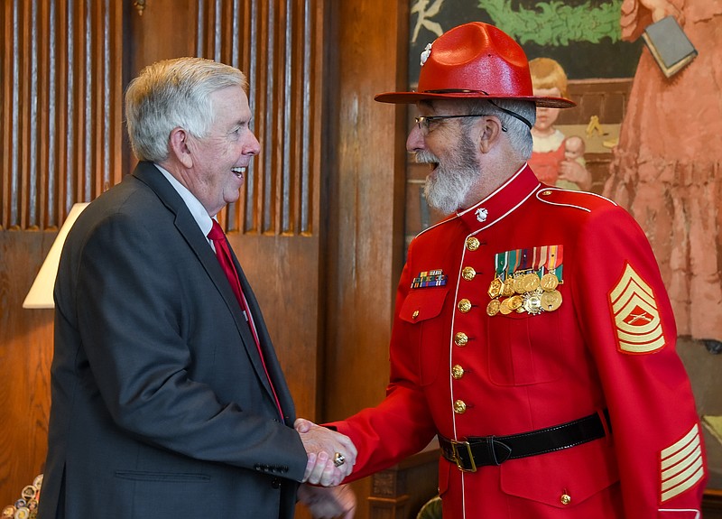 Julie Smith/News Tribune photo: 
Missouri Gov. Mike Parson greets Master Sgt. Klaus as he entered Parson's office Wednesday, Sept. 14, 2022. Klaus was there to to accept, on behalf of Toys for Tots,  a proclamation from Gov. Parson, honoring 75 years of service by the charitable organization.