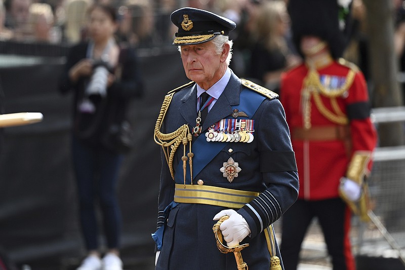 Britain's King Charles III walks behind the coffin during the procession for Queen Elizabeth II, in London, Wednesday, Sept. 14, 2022. The Queen will lie in state in Westminster Hall for four full days before her funeral on Monday Sept. 19. (Kate Green/Pool Photo via AP)