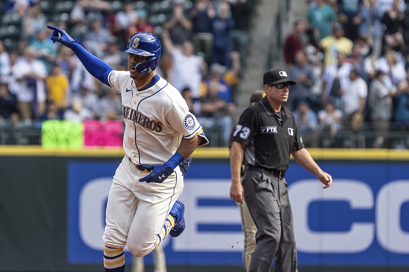 Seattle Mariners' Julio Rodriguez rounds the bases after hitting a solo home run off San Diego Padres starting pitcher Mike Clevinger during the first inning of a baseball game Wednesday in Seattle. - Photo by Stephen Brashear of The Associated Press