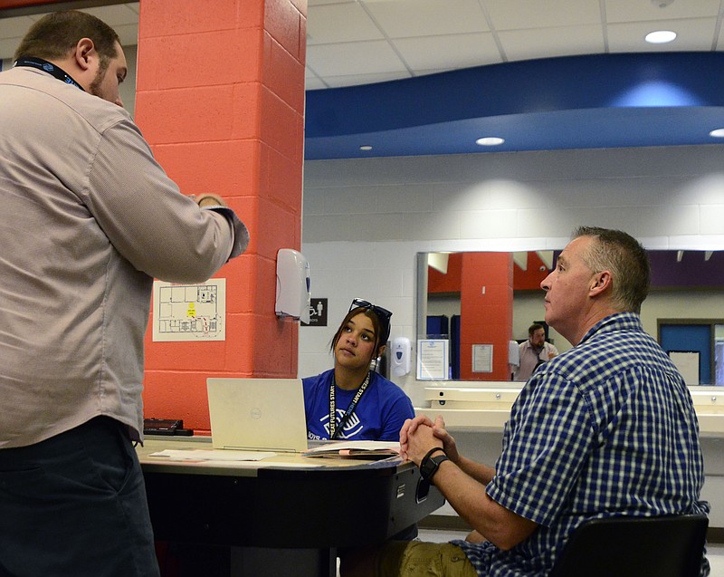 Eileen Wisniowicz/News Tribune photo: 
Wade Middaugh talks with Jaida Walker and David Hendrickson on Thursday, Sept. 1, 2022 at the Boys and Girls Club in Jefferson City. The Boys and Girls Club recently hired former teachers to take on administrative roles. Middaugh notes the importance of hiring people that bring teaching experience with them to the Boys and Girls Club.