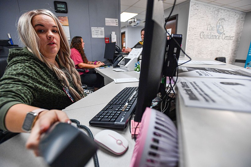 KateLeigh McAllister (left) and Kristina Fuller with intake services work, Thursday, Sept. 15, 2022, at The Guidance Center in Fort Smith. The Sebastian County Quorum Court at a special meeting Tuesday approved allocating $675,300 in American Rescue Plan funds to create and operate a sobering center at the Guidance Center through 2023. Visit nwaonline.com/220918Daily/ for today's photo gallery.
(NWA Democrat-Gazette/Hank Layton)