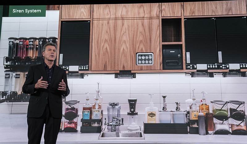 John Culver, North America group president and chief operating officer, introduces the Siren System, an overhaul of equipment used to make drinks and prepare food in stores, during Starbucks Investor Day, Tuesday, Sept. 13, 2022, in Seattle. (AP Photo/Stephen Brashear)