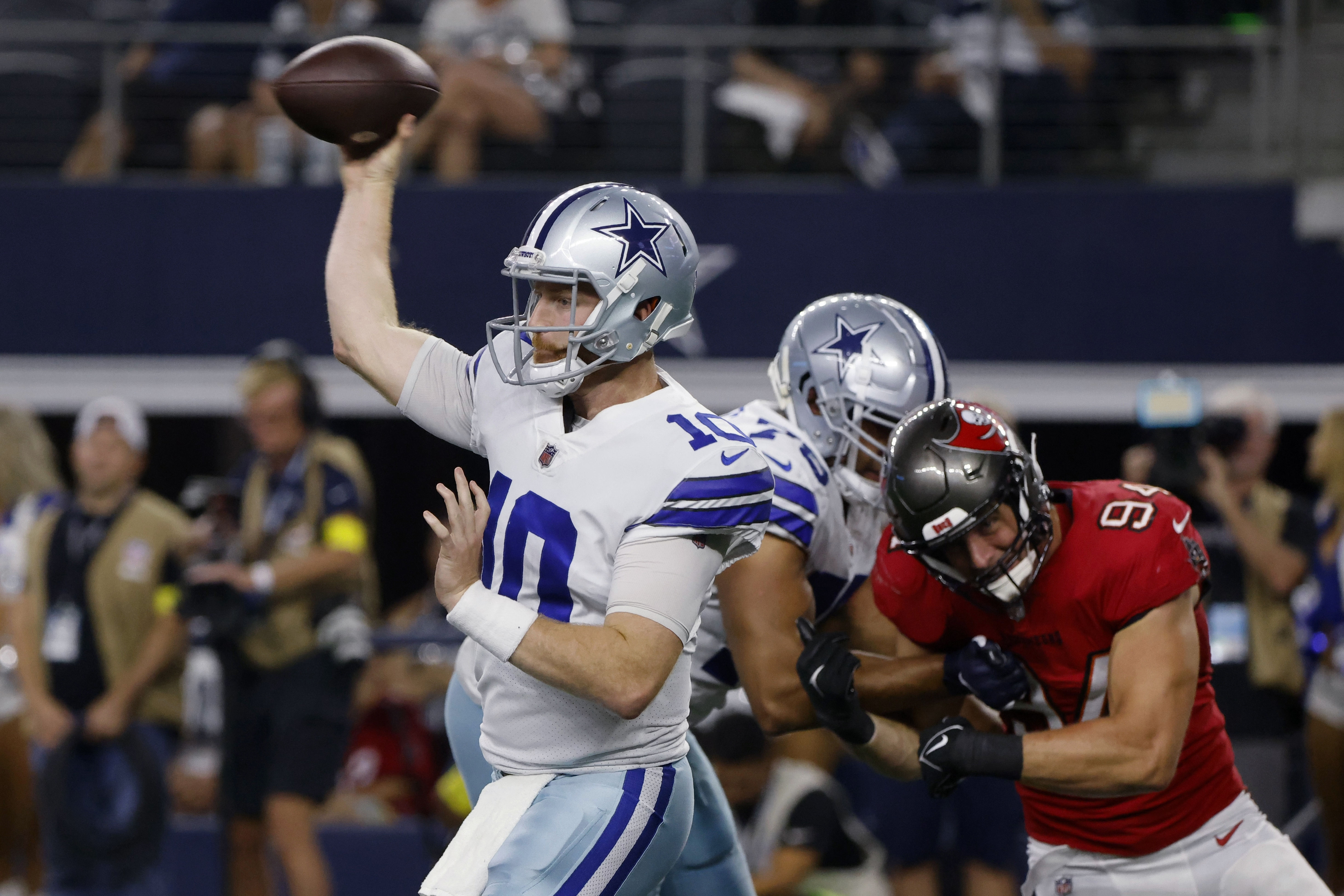 Andy Dalton of the Dallas Cowboys rushes during the first quarter of