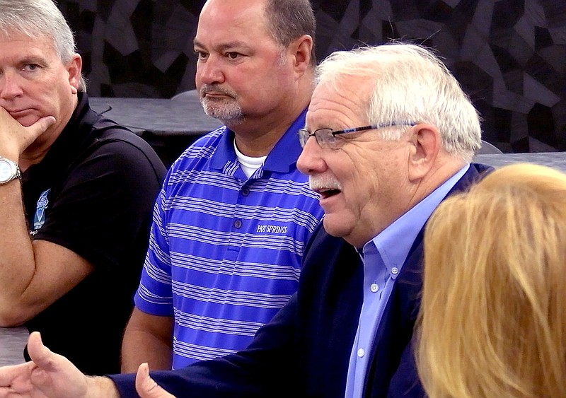 State Rep. Richard McGrew, R-District 22, far right, talks about teacher pay during Friday’s Hot Springs World Class High School Student Council Council presentation, as Hot Springs City Manager Bill Burrough, middle, and Greater Hot Springs Chamber of Commerce President Gary Troutman look on. - Photo by Lance Porter of The Sentinel-Record