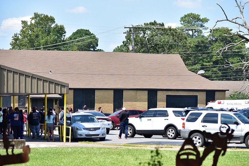 Students and guardians exit the front entrance of Watson Chapel Junior High School on Friday, Sept. 16, 2022, after a 911 text that authorities called a prank was reported. (Pine Bluff Commercial/I.C. Murrell)