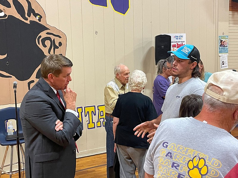 Rogers schools Superintendent Jeff Perry, left, talks with a community member on Tuesday, Sept. 13, 2022, after a public forum held at Garfield Elementary School to discuss the school's future.
(NWA Democrat-Gazette/DAVE PEROZEK)