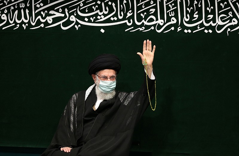 In this image released by the official website of the office of the Iranian supreme leader, Supreme Leader Ayatollah Ali Khamenei waves to his well-wishers during a religious ceremony, in Tehran, Iran, Saturday, Sept. 17, 2022. Khamenei spoke to students in person Saturday after being out of the public eye for nearly two weeks causing speculation that he was sick. (Office of the Iranian Supreme Leader via AP)