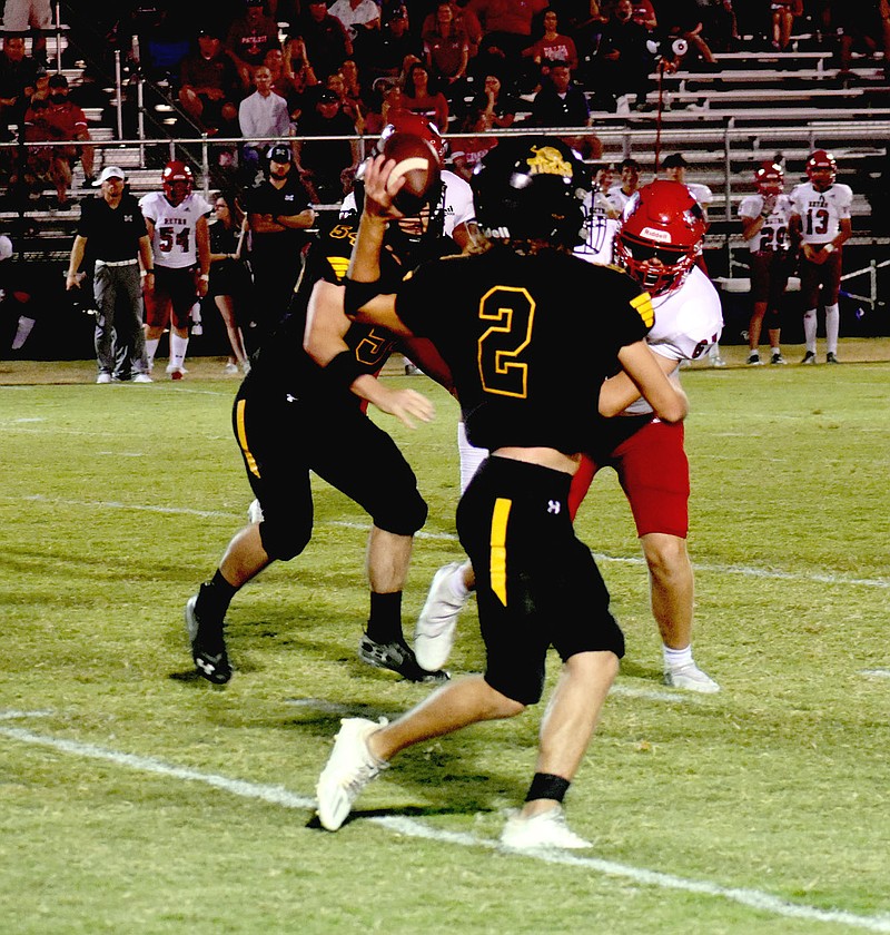 MARK HUMPHREY  ENTERPRISE-LEADER/Prairie Grove junior backup quarterback Luke Vance makes a difficult throw with his left hand while moving to his right. Bannon completed a 28-yard pass to David Stephens to convert second-down-and-8 while leading the second team offense on a 14-play, 80-yard touchdown drive capped by a fourth down 10-yard scoring pass with 35 seconds remaining. Prairie Grove sustained a 41-21 to Tulsa Metro Christian in the Tigers' final nonconference game. Prairie Grove begins its first season of 5A West play this week on the road at Pea Ridge. Kickoff is set for 7 p.m. at Blackhawk Stadium.