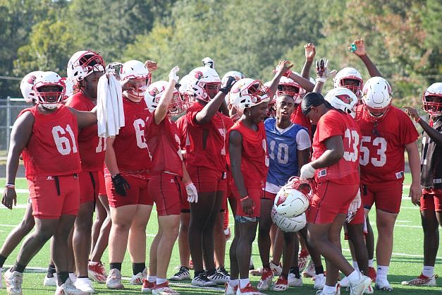Photo By: Michael Hanich
Camden Fairview Cardinals break it down after a drill in practice.