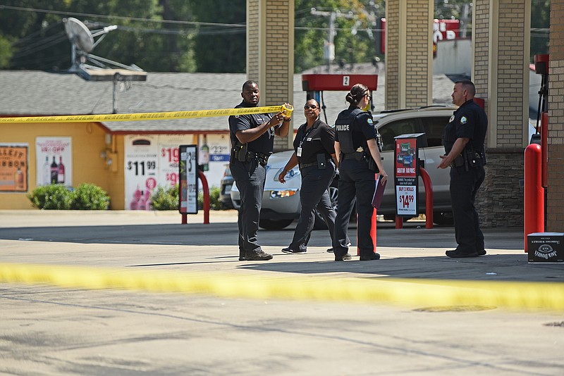 The Little Rock Police Department investigates the scene of a fatal shooting Sunday afternoon at the Murphy Express near the intersection of Baseline and I-30 Frontage roads.
(Arkansas Democrat-Gazette/Staci Vandagriff)