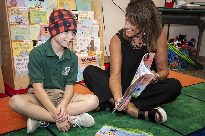 Matthew Shelby and Tracy Peterson talk about their favorite parts of the book "Beanies, Ball Caps and Being Bald" on Sept. 20, 2022, at Episcopal Collegiate School. (Arkansas Democrat-Gazette/Cary Jenkins)