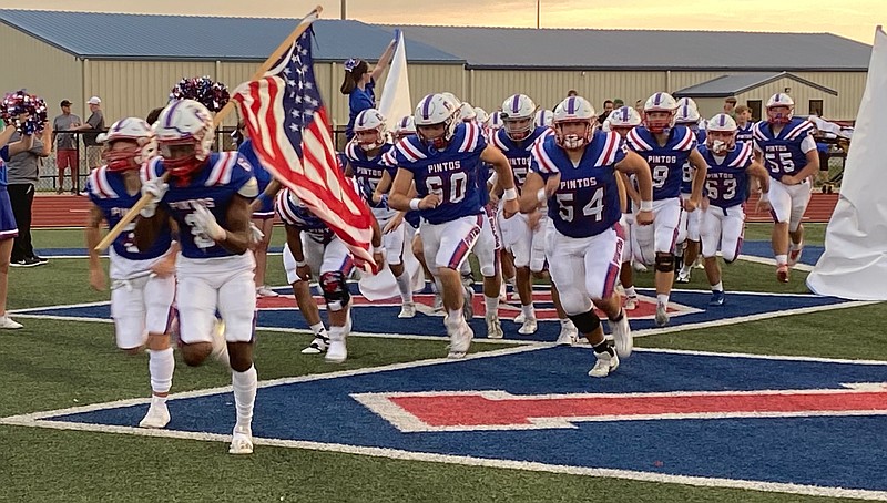 The California pintos charge onto the field to take on the Blair Oaks Falcons on Friday night. (Democrat Photo/Evan Holmes)