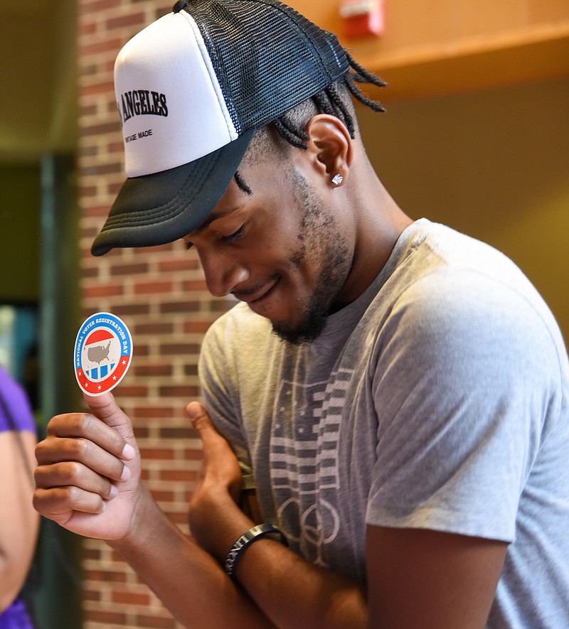 Julie Smith/News Tribune photo: 
Hollis Franklin poses for videos and pictures after he scanned a QR code to register to vote Tuesday, Sept. 20, 2022, during National Voter Registration Day activities at in Scruggs Hall at Lincoln University in Jefferson City.