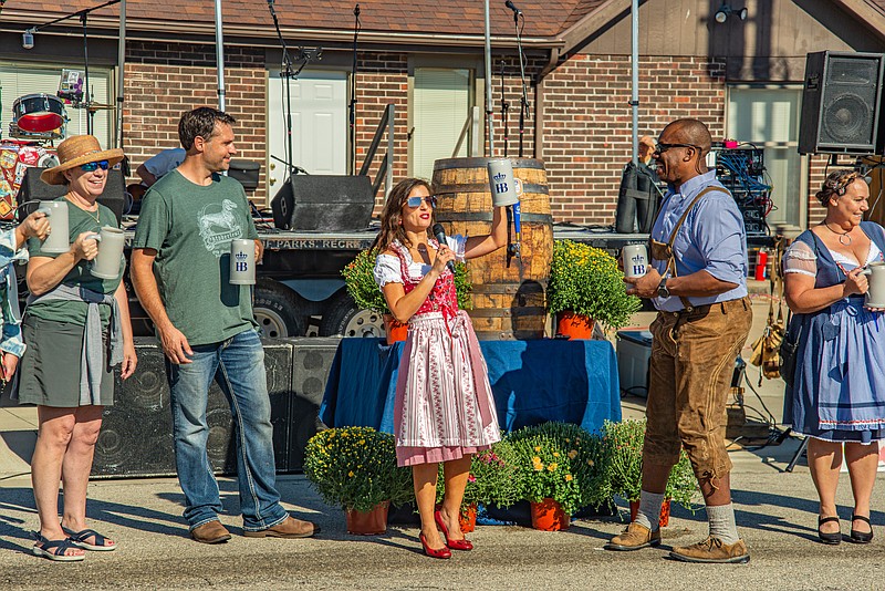 Jefferson City Mayor Carrie Tergin opens a past Old Munichburg Oktoberfest with ceremonial tapping of the keg.  (Ken Barnes/News Tribune file photo)