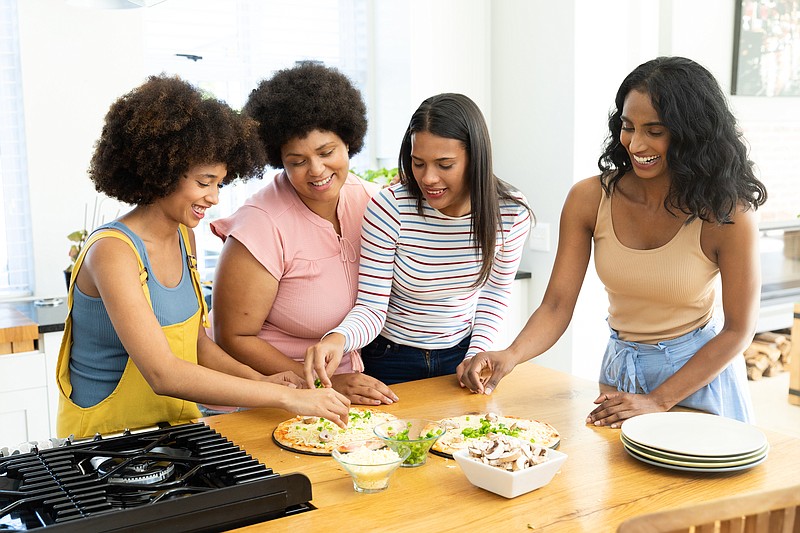 A kitchen island that allows multiple people to prepare food at the same is a great entertaining and gathering space. (Wavebreakmediamicro/Dreamstime/TNS)