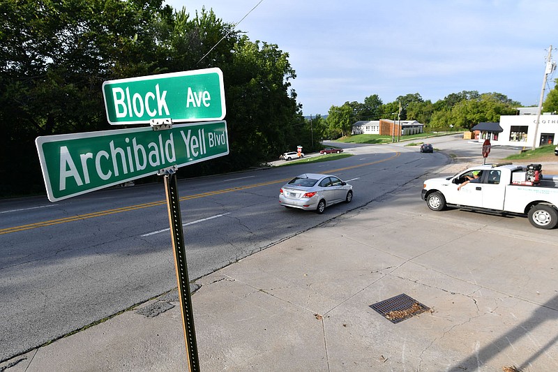 Traffic passes Sept. 1 along Archibald Yell Boulevard in Fayetteville. The City Council on Tuesday voted 7-1 to rename Archibald Yell Boulevard to Nelson Hackett Boulevard. Hackett escaped slavery and fled to Canada in 1841 but was the first and only person extradited back to the United States, prompting the British government to make extradition of those fleeing slavery to Canada nearly impossible.
(NWA Democrat-Gazette/Andy Shupe)