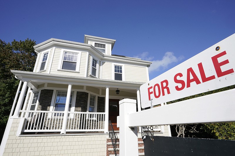 FILE - A for sale sign stands in front of a house on Oct. 6, 2020, in Westwood, Mass. Sales of previously occupied U.S. homes slowed in August 2022 for the seventh month in a row, as sharply higher mortgage rates and rising home prices made homebuying less affordable. (AP Photo/Steven Senne, File)