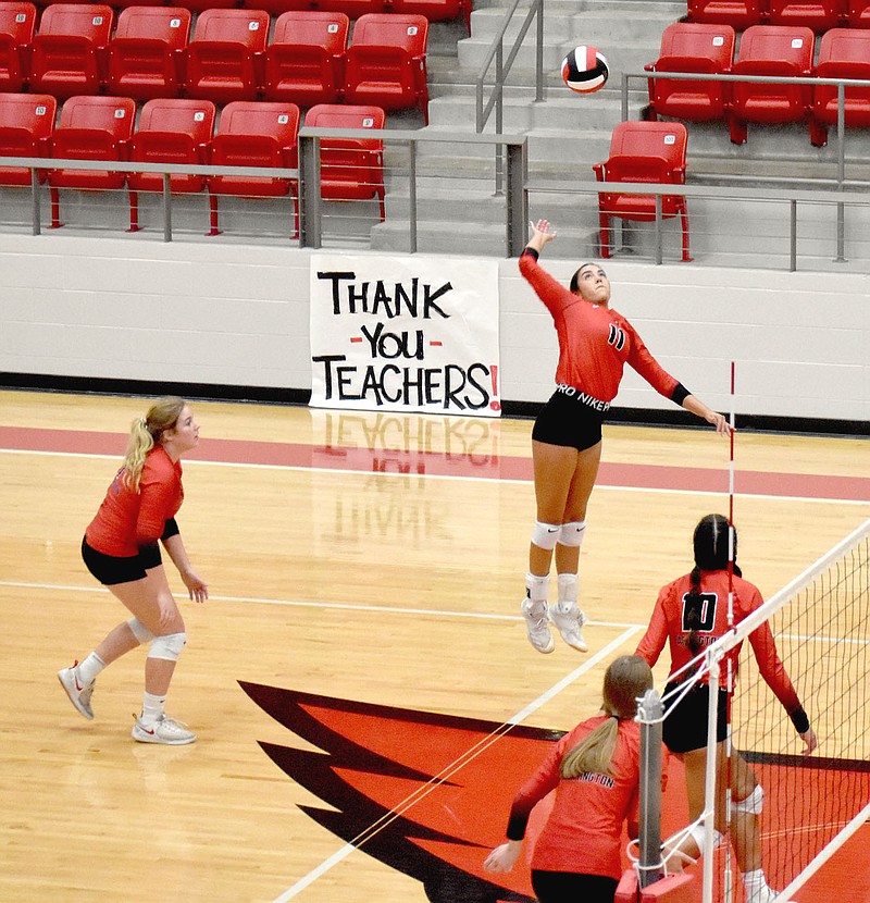 MARK HUMPHREY  ENTERPRISE-LEADER/Farmington senior Zoe Nix elevates for big hit against Gravette during the Lady Cardinals' 3-set sweep of the Lady Lions (25-16, 25-19, 25-19) on Tuesday, Sept. 20, at Cardinal Arena.