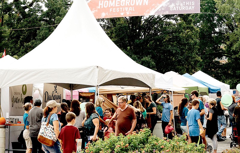 Photo submitted Attendees of the 2021 Homegrown Festival navigate the various tents of vendors.