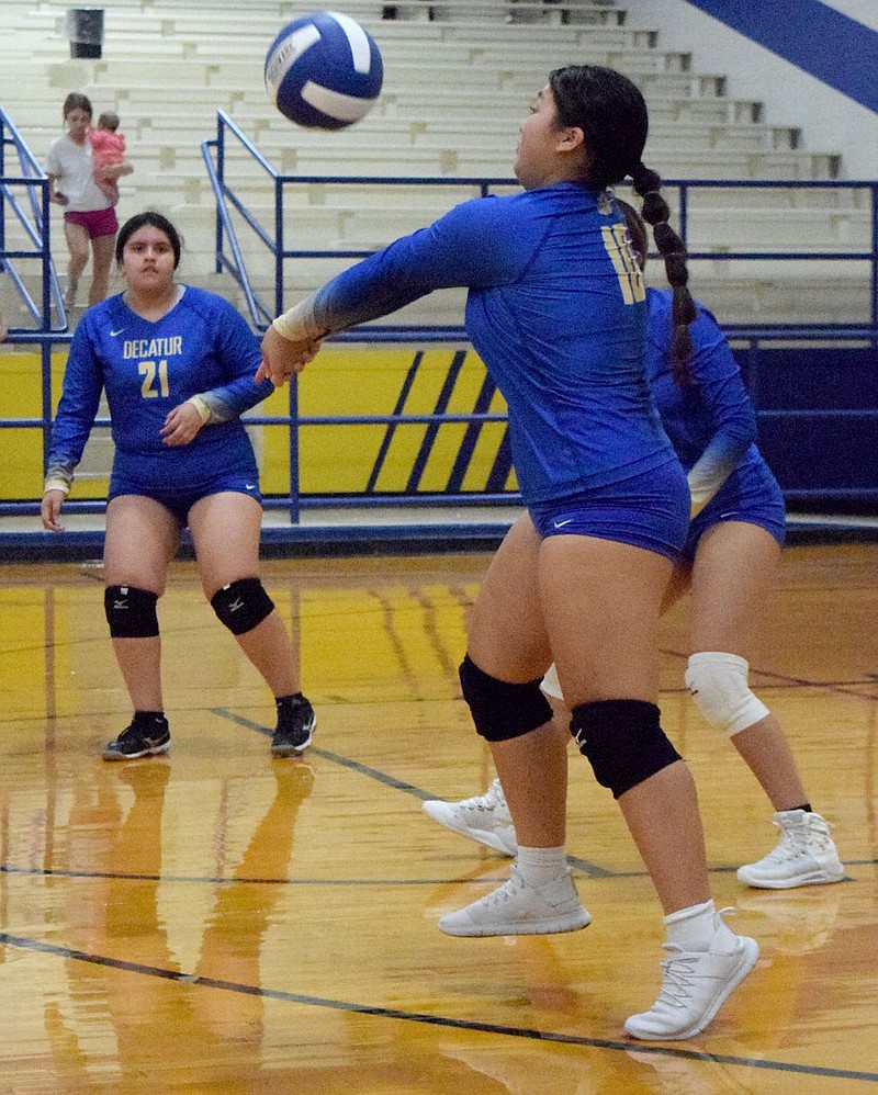 Westside Eagle Observer/MIKE ECKELS
From the back row, Lindy Lee hits the ball towards a setter near the front line during the Decatur-Life Way conference volleyball match at Peterson-Owens Fieldhouse in Decatur Sept. 20.