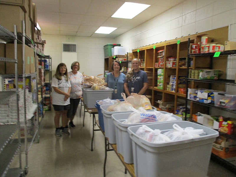 The Fayetteville/Springdale Elks Lodge No. 1987 donated $2,000, which came from a Beacon Grant, to the Prairie Grove backpack program. The money helps offset the cost of running this food assistance program, which is funded entirely through donations and run by volunteers. This program provides weekend food assistance to 120 students in grades Pre-K through 12 whose families are facing food insecurities at home. This program runs each week from September through May. Each Friday eligible students are sent home with a bag of 13 to 14 items which include two breakfast items, two lunch items, three dinner items, six snack items, and a milk or juice. All items are child friendly so each child can prepare it themselves. The Elks Lodge also helps in packing the bags. Pictured are Elk Marge Guist (from left); Mary Bartholomew, director of the backpack program in Prairie Grove; Shirley Schlegel; and Jenny Stinchcomb.

(Courtesy Photo)
