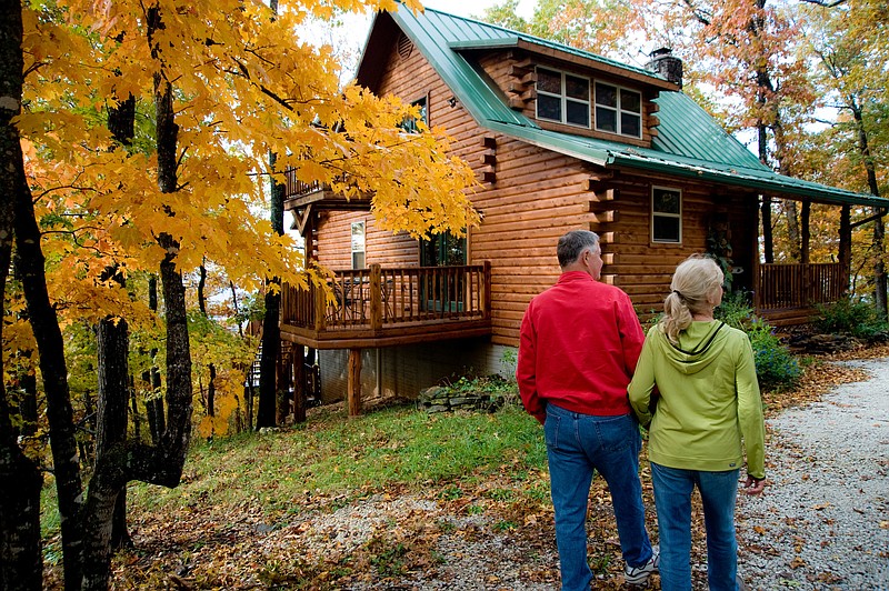 Fall colors are shown in this file photo of Bluff Dwellers Cabins. Fall color change begins in the Ozarks of northern Arkansas in late September or early October. Weekly fall color reports are available at https://www.arkansas.com/things-to-do/attractions/fall-attractions. (Special to The Commercial/Arkansas Tourism)