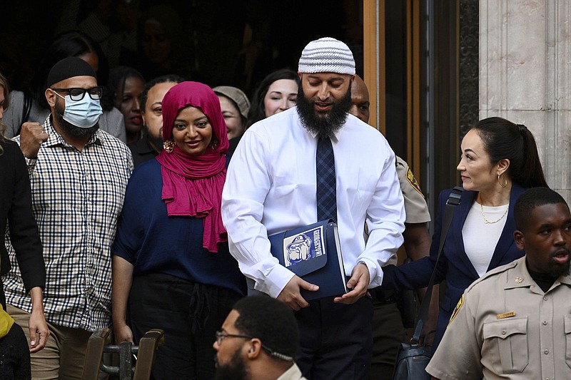 Adnan Syed (center right) leaves the courthouse after the hearing Sept. 19 in Baltimore. (Baltimore Sun/AP/Jerry Jackson)