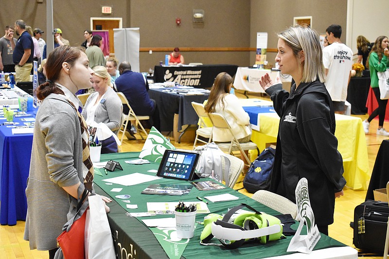 Democrat photo/Garrett Fuller — Etelka Vaughan, left, speaks with Mackenzie Roberts, a representative from Central Methodist University, on Thursday (Sept. 22, 2022,) at the second-annual Moniteau Career and Resource Fair at United Church of Christ in California.