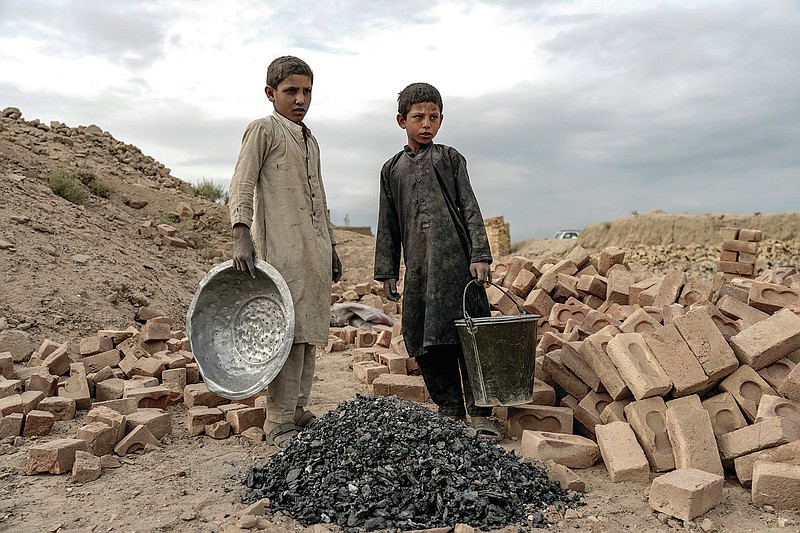 Afghan children work at a brick factory July 23 on the outskirts of Kabul, Afghanistan. (AP/Ebrahim Noroozi)