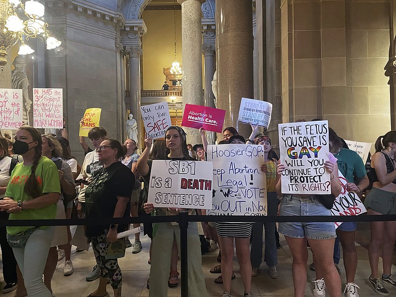 FILE - Abortion-rights protesters fill Indiana Statehouse corridors and cheer outside legislative chambers, Friday, Aug. 5, 2022, as lawmakers vote to concur on a near-total abortion ban, in Indianapolis. An Indiana judge on Thursday, Sept. 22, blocked the state’s abortion ban from being enforced, putting the law on hold as abortion clinic operators argue that the new law violates the state constitution.(AP Photo/Arleigh Rodgers, File)