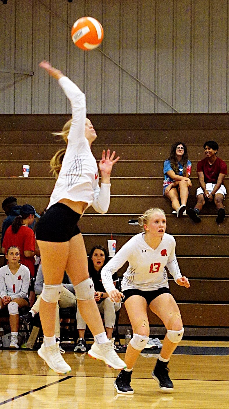 Westside Eagle Observer/RANDY MOLL
Gravette sophomore Drew Madison puts one over the net for the winning point in the first set of the Gravette-Prairie Grove match in Gravette on Thursday. Freshman setter Piper Batie stands at the ready to defend if Prairie Grove blocks the ball.