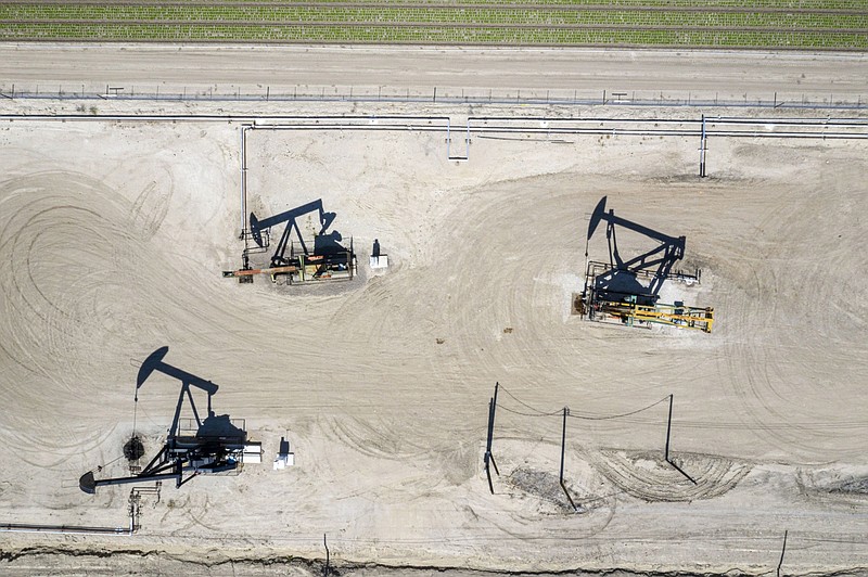 Oil well pump jacks operated by Chevron Corp. in San Ardo, California, on April 27, 2021. MUST CREDIT: Bloomberg photo by David Paul Morris.