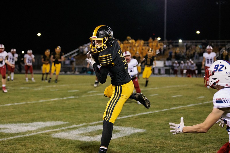 Fulton wide receiver Gabe DeFily catches a pass from quarterback Walker Gohring Friday at Robert E. Fisher Jr. Stadium in Fulton. (Courtesy/Shawley Photography)