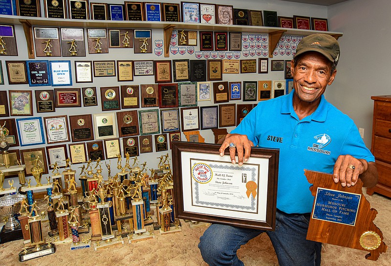 Julie Smith/News Tribune photo: 
Steve Johnson is shown in the trophy room of his home. Johnson is a champion horseshoe thrower who was inducted into the Missouri Horseshoe Pitchers Association Hall of Fame in September 2022.