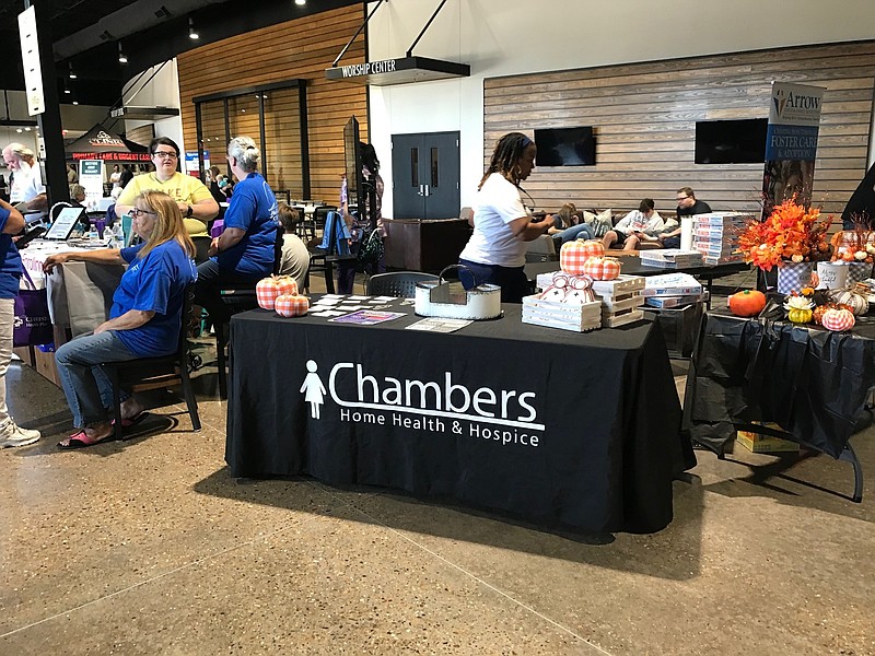 Chambers Home Health and Hospice greets sets up a table for visitors during Church on the Rock's first Community Health Fair on Saturday, Sept. 24, 2022, at the church in Texarkana, Texas. Chambers was one of 55 participating vendors. The church plans to hold next year's health fair in October. (Staff photo by Greg Bischof)