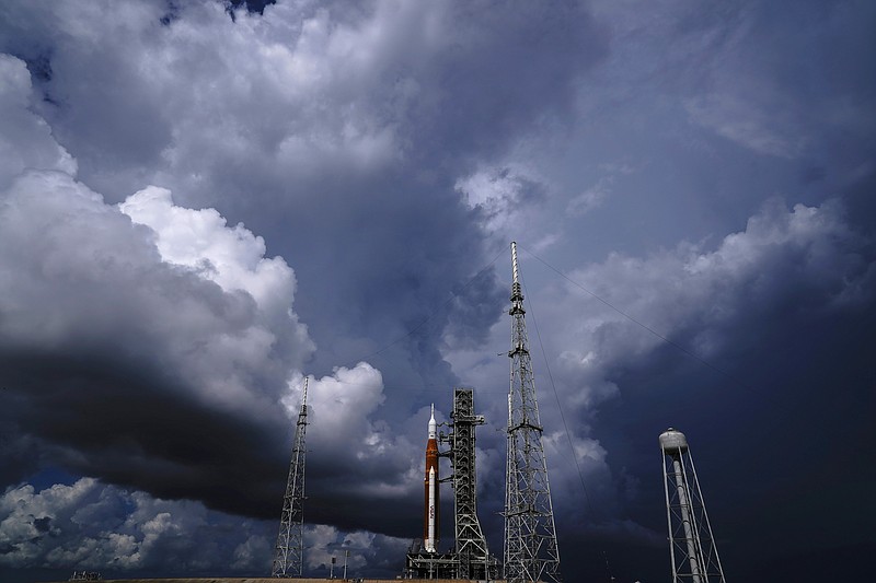 FILE - The NASA moon rocket stands on Pad 39B before a launch attempt for the Artemis 1 mission to orbit the moon at the Kennedy Space Center, Friday, Sept. 2, 2022, in Cape Canaveral, Fla. On Friday, Sept. 23, 2022, a storm in the Caribbean is threatening to delay NASA's third attempt to launch the rocket. (AP Photo/Brynn Anderson, File)