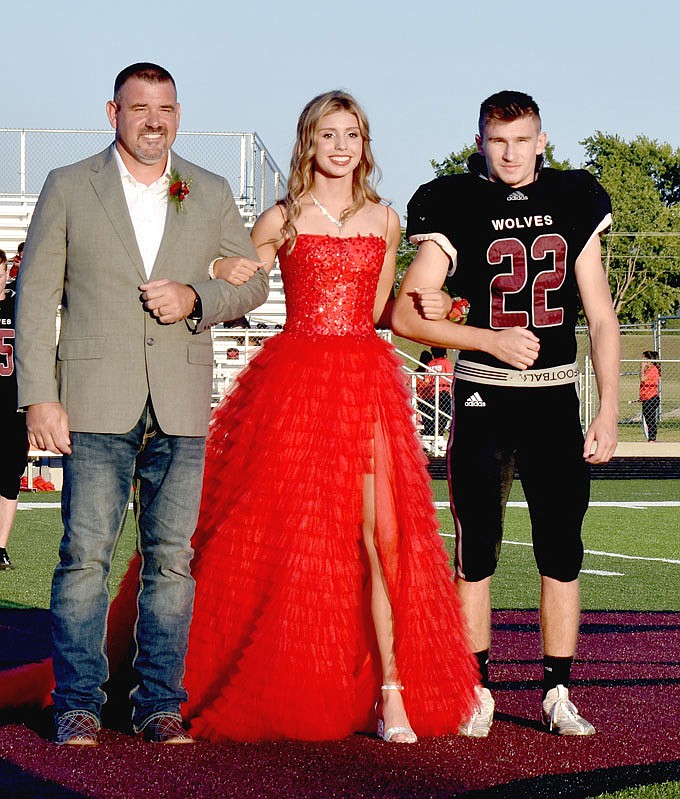 MARK HUMPHREY  ENTERPRISE-LEADER/Lincoln freshman maid Hannah Remington, daughter of Lindsey Remington and Rick and Melissa Remington, escorted by her father and senior Layne Sellers.