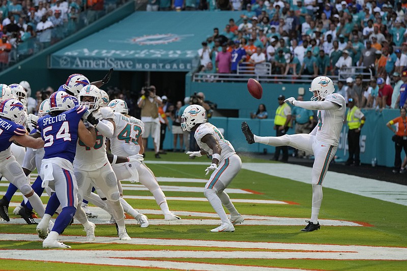 Miami Dolphins safety Brandon Jones (29) grabs Buffalo Bills running back  James Cook (28) during the