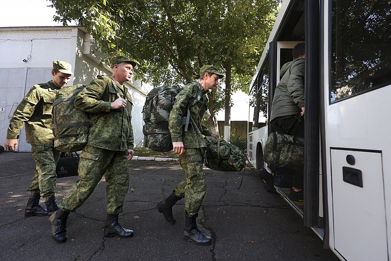 Russian recruits take a bus near a military recruitment center in Krasnodar, Russia, Sunday, Sept. 25, 2022. Russian President Vladimir Putin on Wednesday ordered a partial mobilization of reservists to beef up his forces in Ukraine. (AP Photo)