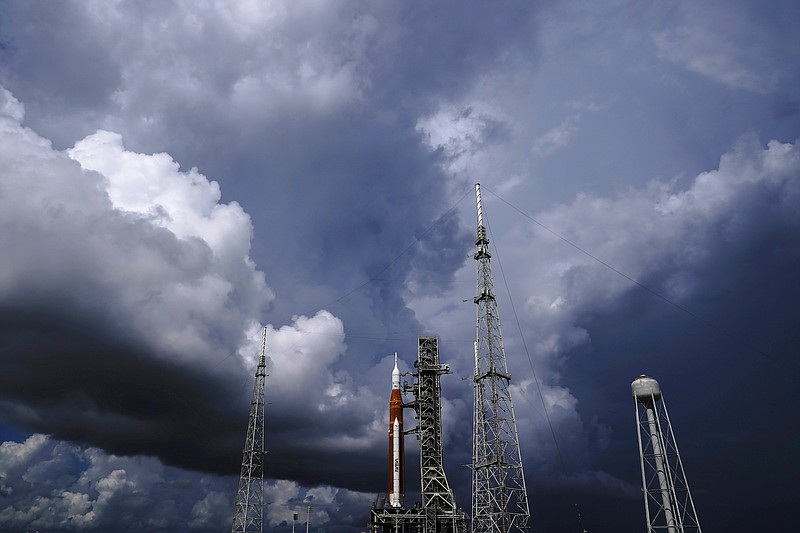 The NASA moon rocket stands on Pad 39B before a launch attempt for the Artemis 1 mission to orbit the moon at the Kennedy Space Center on Sept. 2, 2022, in Cape Canaveral, Fla. NASA mission managers decided Monday, Sept. 26, 2022, to move its moon rocket off the launch pad and into shelter due to Hurricane Ian's uncertain path. (AP Photo/Brynn Anderson, File)