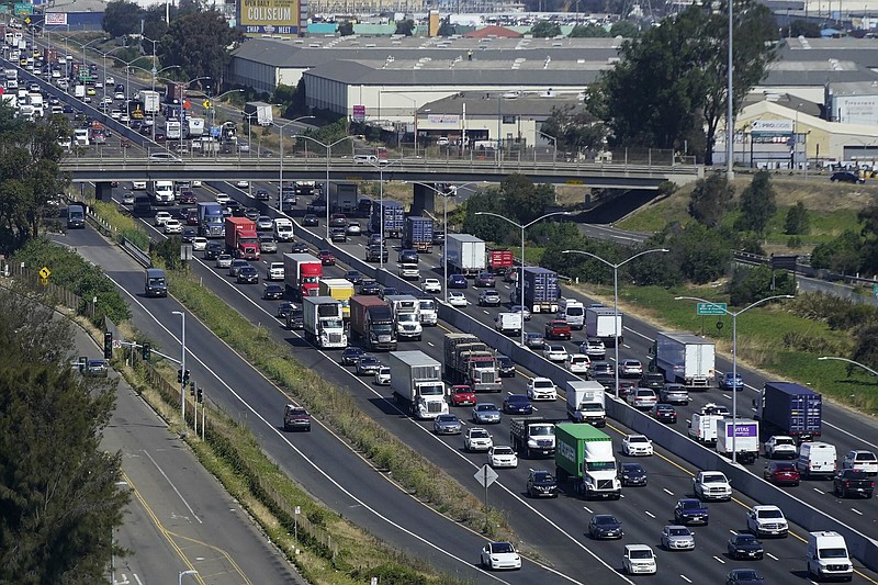 FILE--Traffic moves on Interstate-880 in Oakland, Calif., Tuesday, Aug. 16, 2022. Top U.S. Insurance companies and associations say California is risking a crisis in the nation's largest automobile insurance market by Insurance Commissioner Ricardo Lara's refusal to approve rate increases since the coronavirus pandemic. This is the latest battle in Lara's efforts to compensate consumers that he says were overcharged by insurers during the pandemics early months, when traffic all but disappeared after California imposed the nation's first stay-home order. (AP Photo/Jeff Chiu, File)