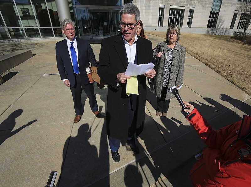 Former state Sen. Gilbert Baker (center) joined by his wife Susan (right) and attorneys Blake Hendrix (left) and Annie Depper makes a statement Jan. 24, 2019, outside the federal courthouse in Little Rock following his arraignment. 
(File Photo/Arkansas Democrat-Gazette)