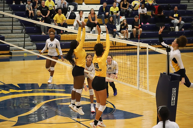 Fulton volleyball's Quaiara Walton and Arianna Conner attempt to block Battle's Jordyn Butler Monday at Battle in Columbia. (Courtesy/Danuser Photography)