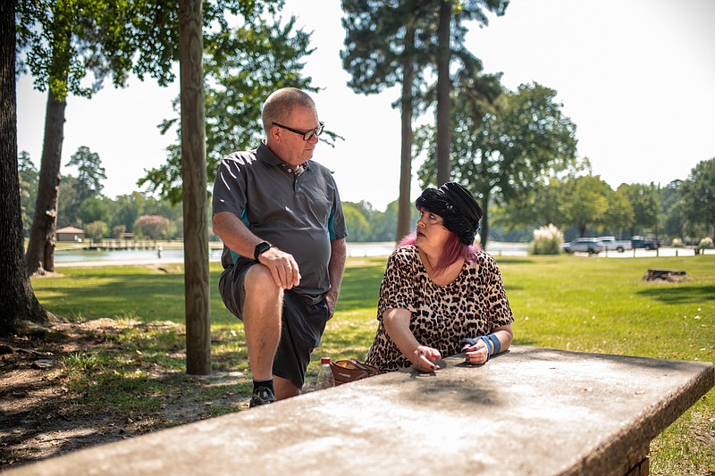 David Dahman and Catt Dahman sit Saturday, Sept. 24, 2022, at one of the filming locations for Catt's film "Sundown" in Texarkana, Texas' Spring Lake Park. Catt Dahman is set to start filming of her new movie "Z is for Zombie" this month. (Staff photo by Erin DeBlanc)