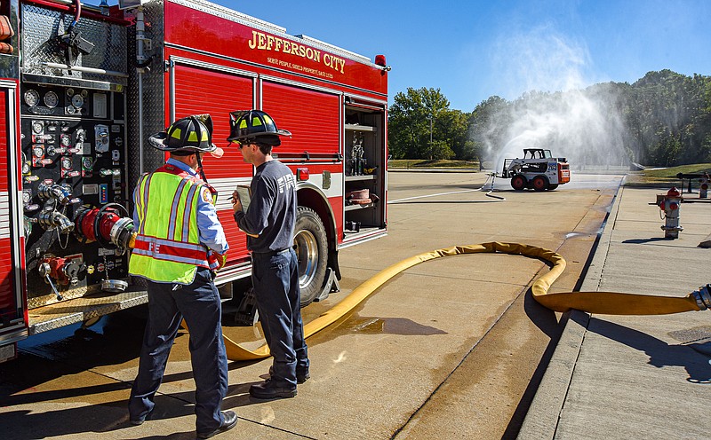 Julie Smith/News Tribune photo:
Jefferson City firefighter/driver Jordan Holland, at right, administers driver promotional testing Wednesday, Sept. 28, 2022, to James Noah at the JCFD training facility in Hyde Park. Noah was one of several firefighters testing to move up the rank to driver.