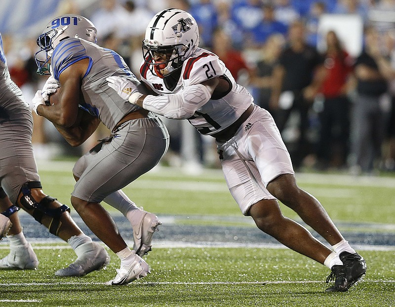 Arkansas State linebacker Melique Straker (21) tackles Memphis running back Brandon Thomas (22) during the fourth quarter of the Red Wolves' 44-32 loss on Saturday, Sept. 17, 2022, at Liberty Stadium in Memphis. 
More photos at www.arkansasonline.com/918asumem/
(Arkansas Democrat-Gazette/Thomas Metthe)