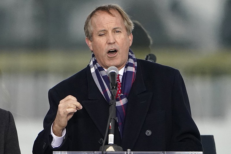 Texas Attorney General Ken Paxton speaks in Washington on Jan. 6, 2021. Paxton ran out of his house Monday, Sept. 26, 2022, and into a truck driven by his wife, a state senator, to avoid being served a subpoena in an abortion access case, according to court documents. (AP Photo/Jacquelyn Martin, File)